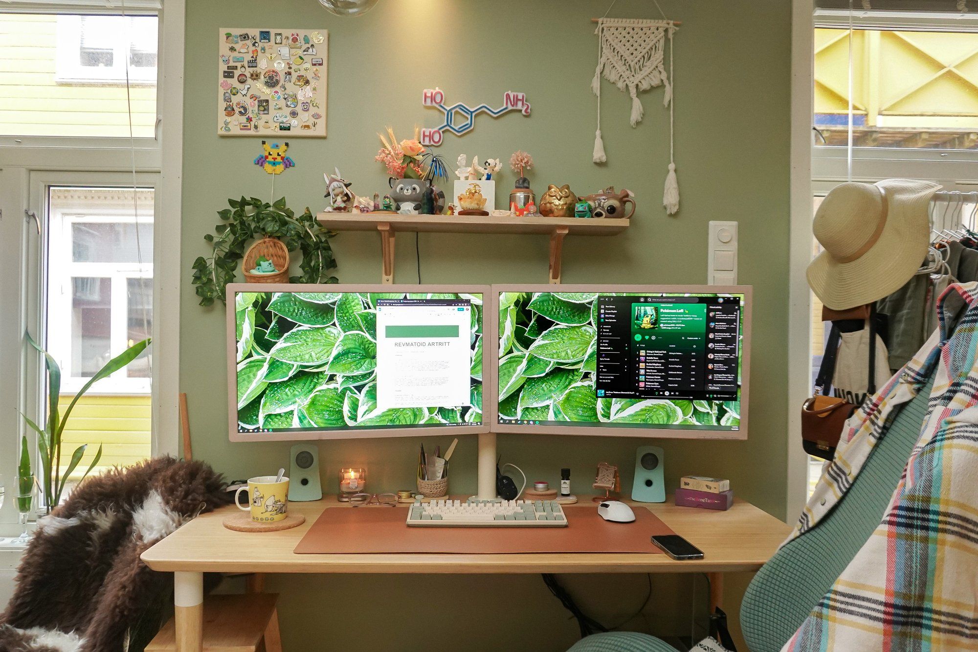 A multi-screen home workspace with a Ducky One 3 mechanical keyboard and monitors adorned with hand-painted frames