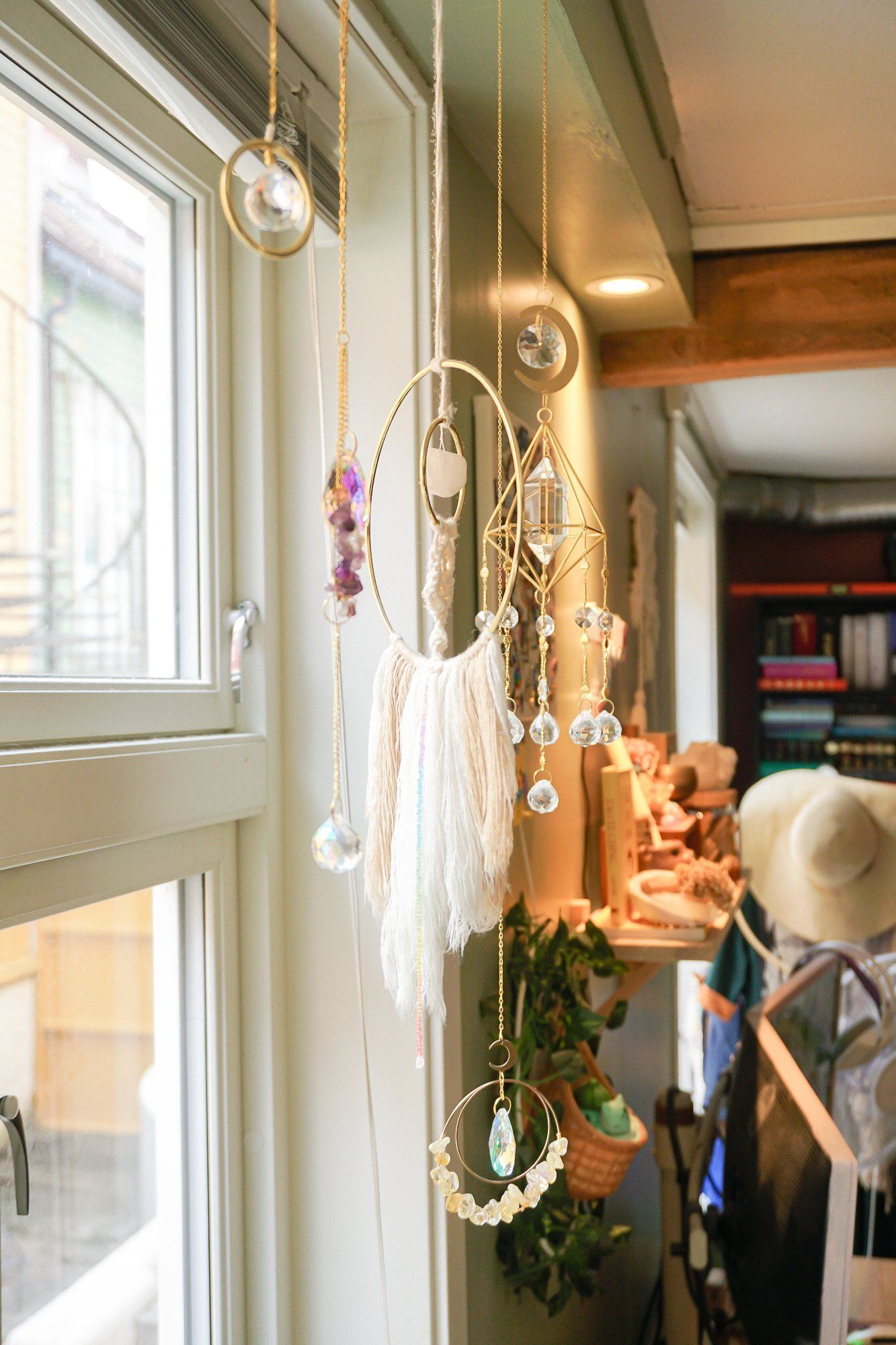 Sun catchers hanging in front of a window in a home office