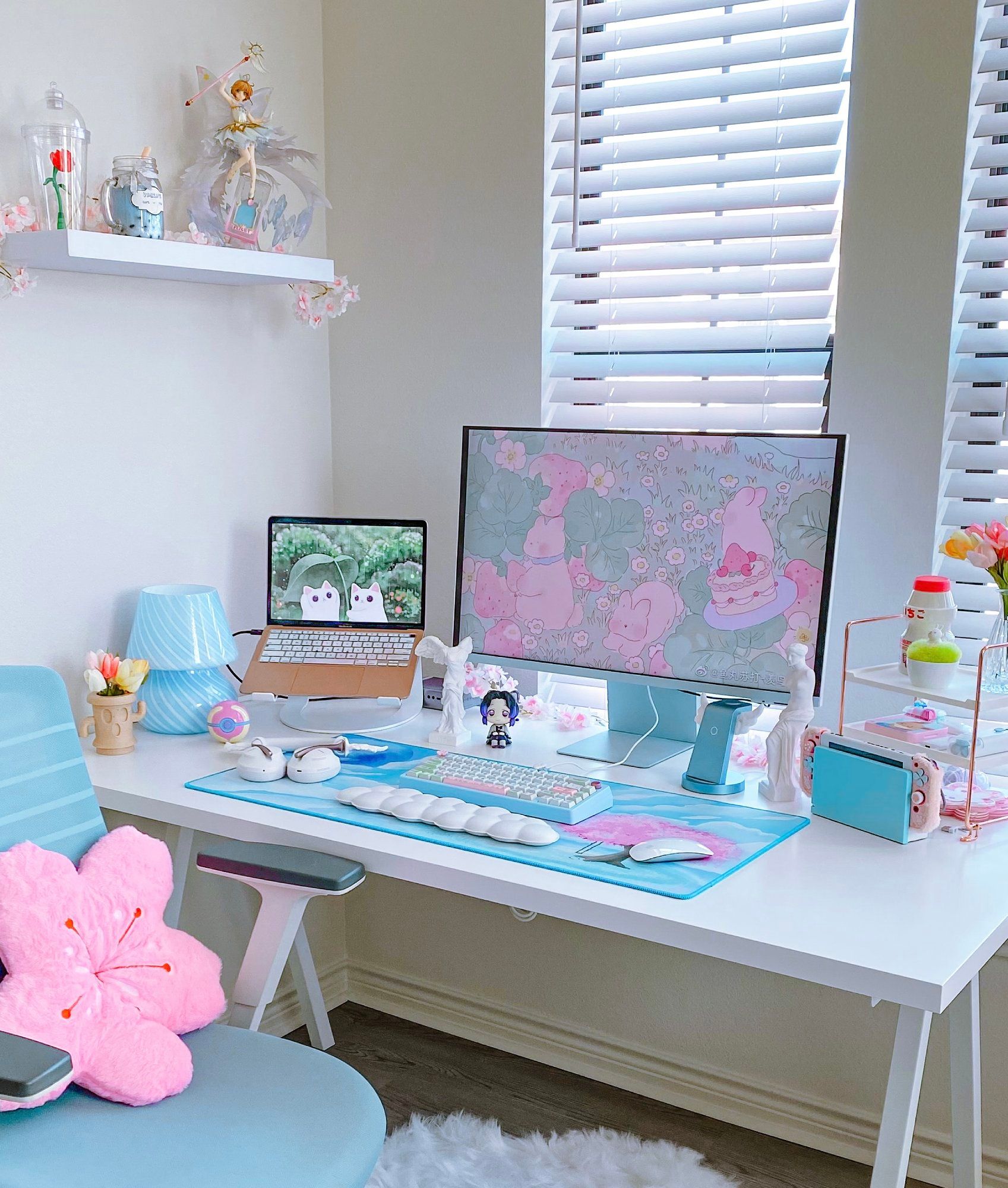 A cute pink and blue gaming setup