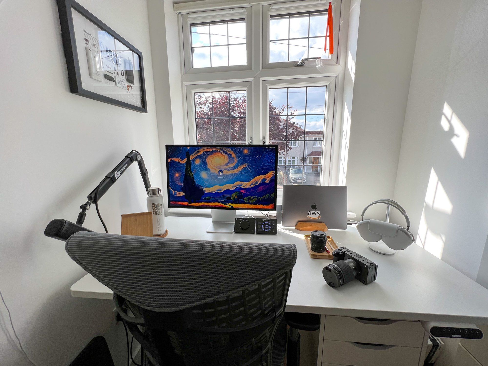 A well-organised small home office standing desk setup