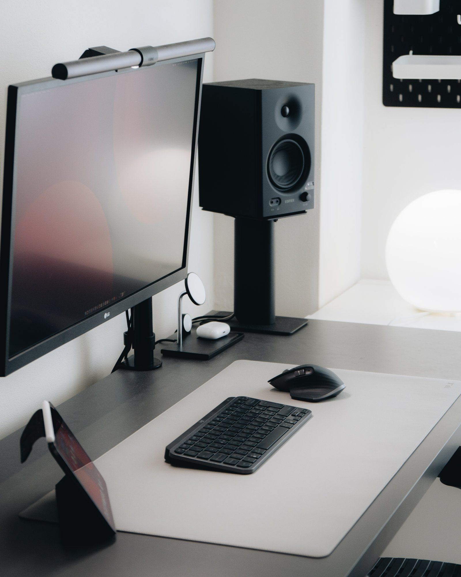 A well-organised black and white home office desk setup