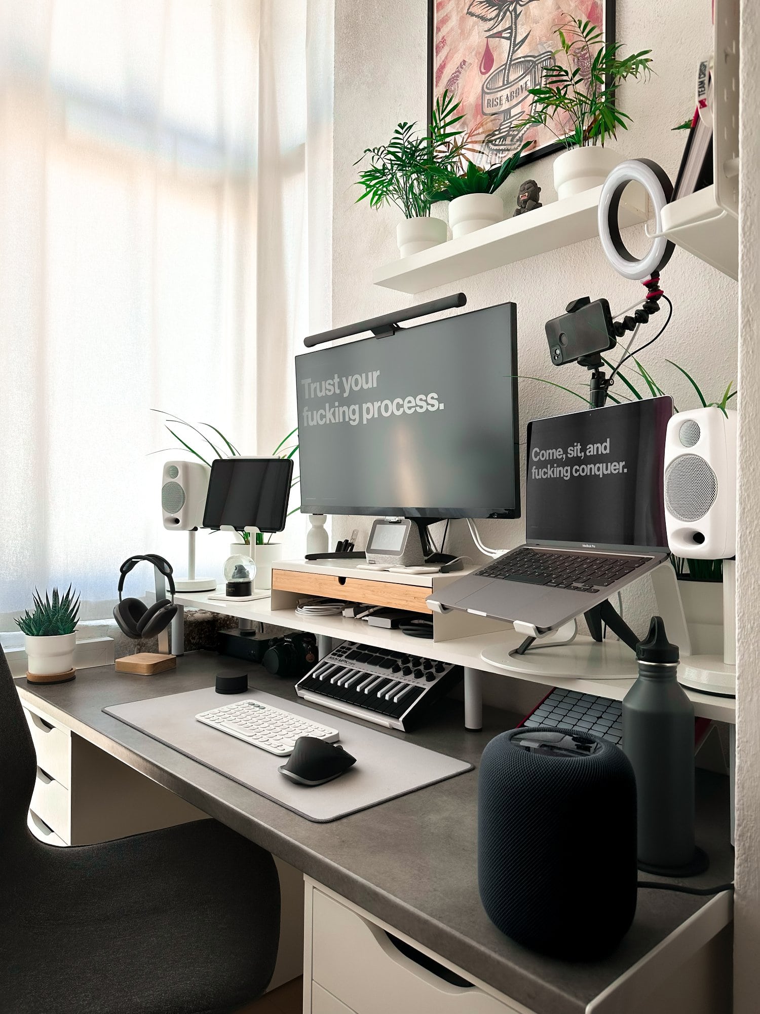An ergonomic small space desk setup with a Philips 4K monitor