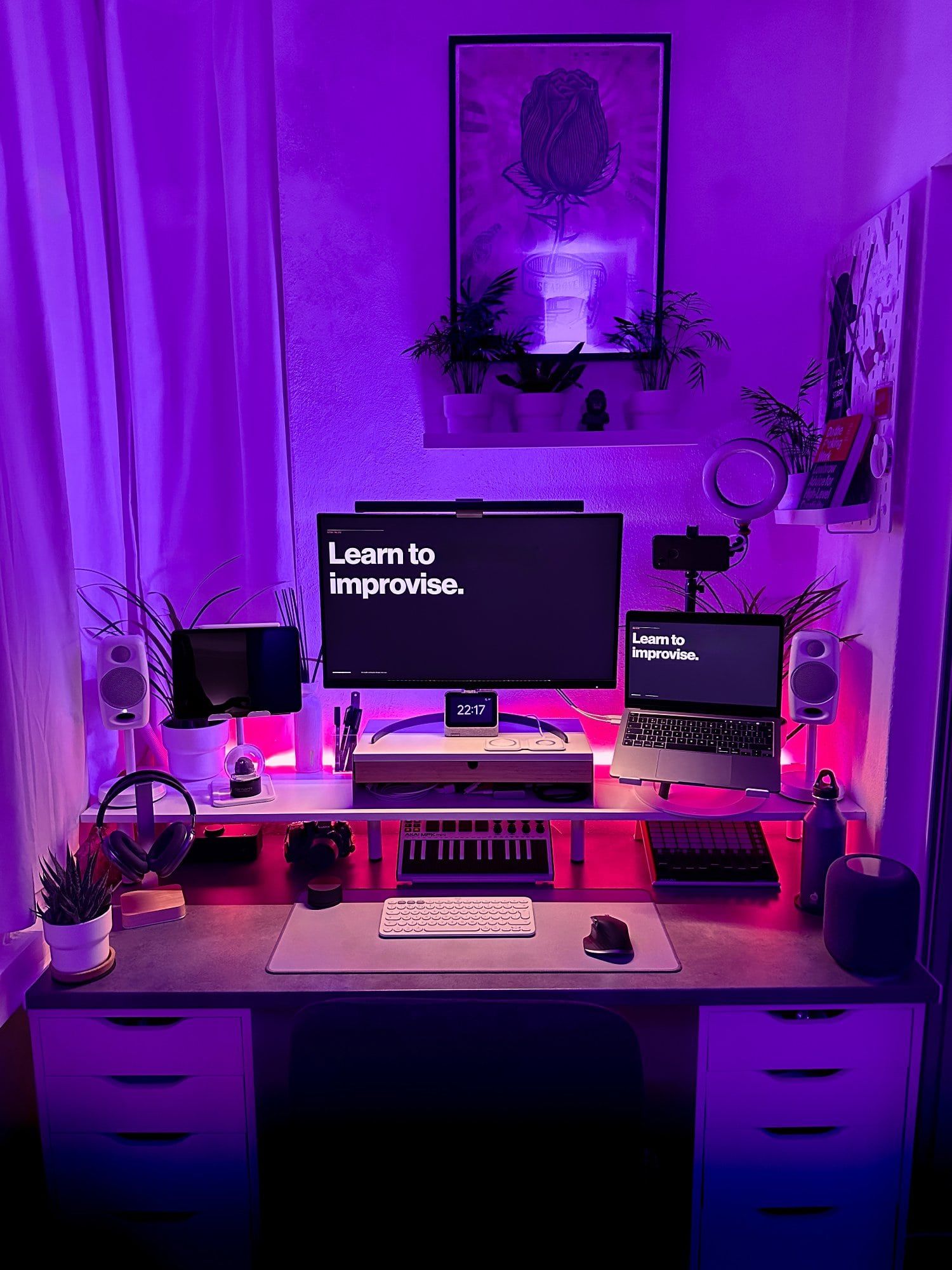 A small home office illuminated by RGB lights