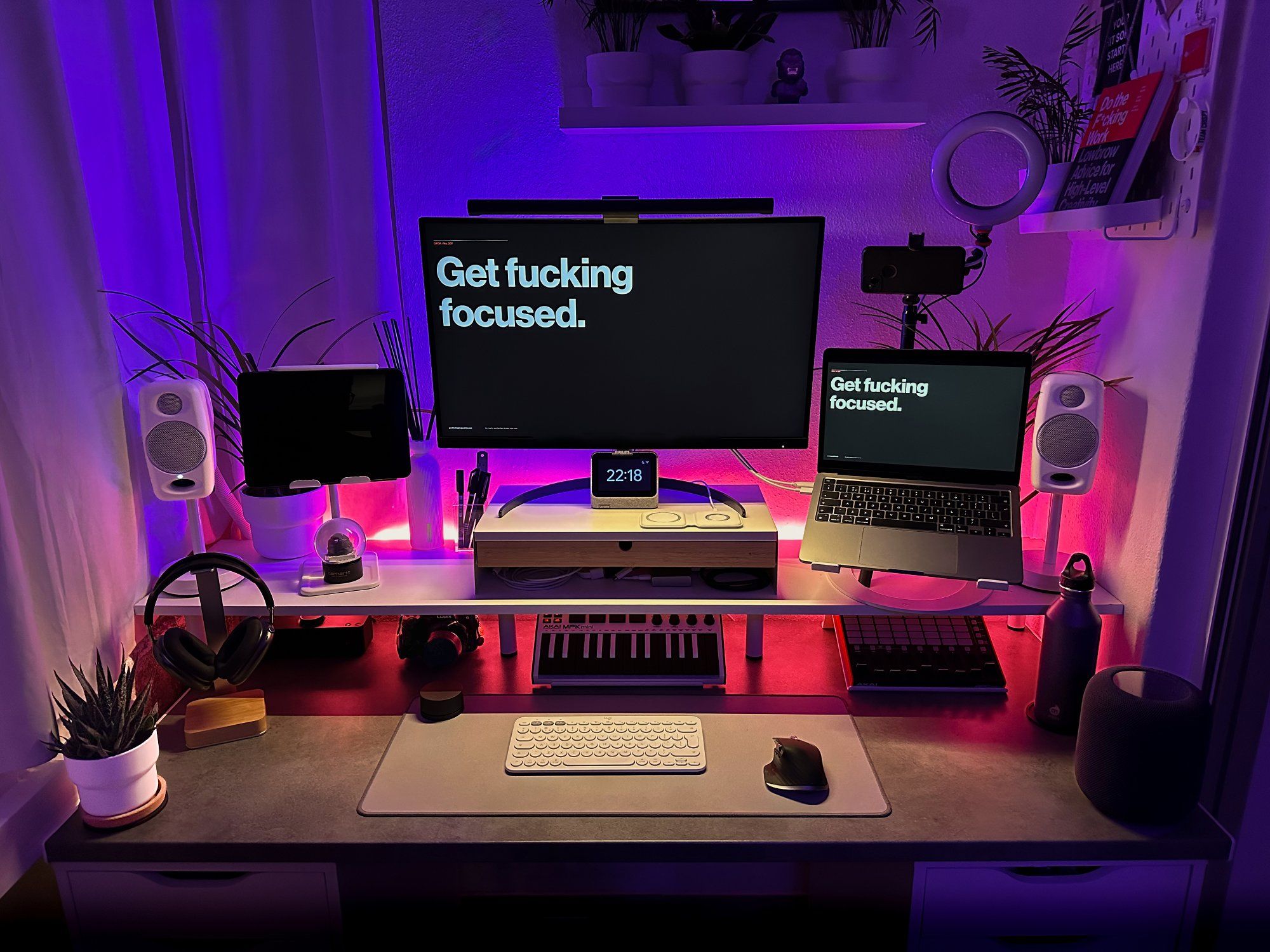 A neatly organised, LED-lit desk setup at night