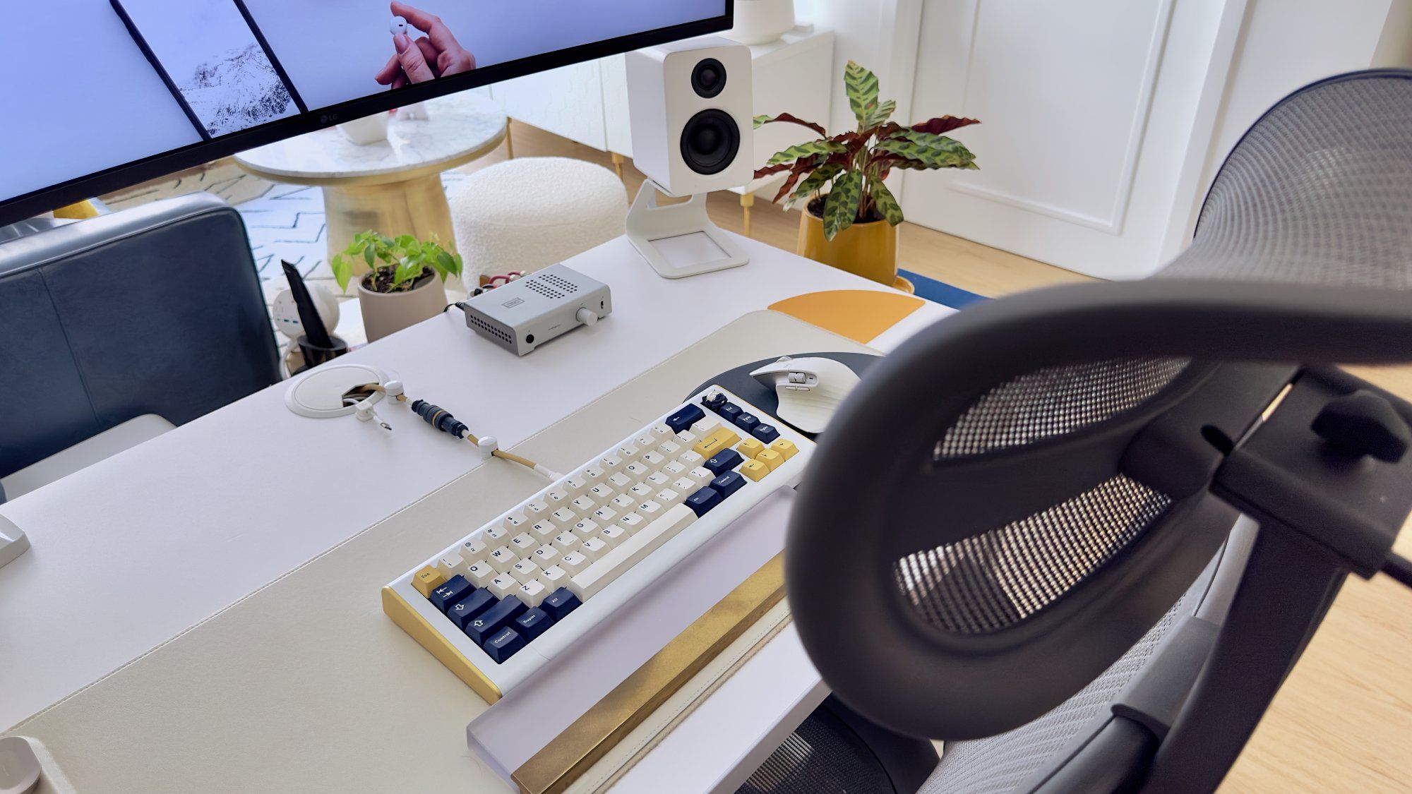 A top view of a small desk setup with an Aeron chair