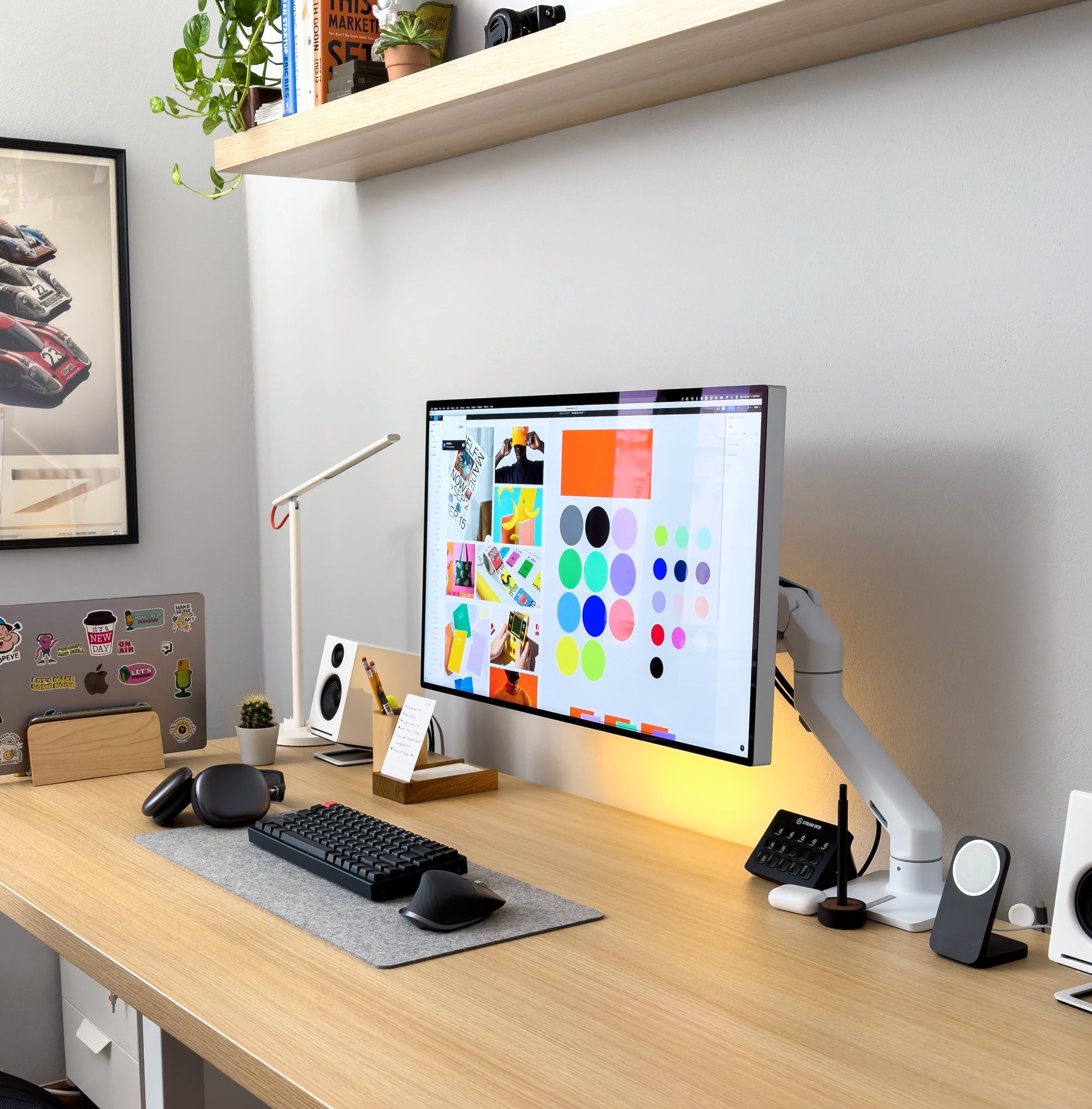 A productive, minimal desk setup showcasing an Apple Pro Display XDR mounted on the Ergotron HX monitor arm