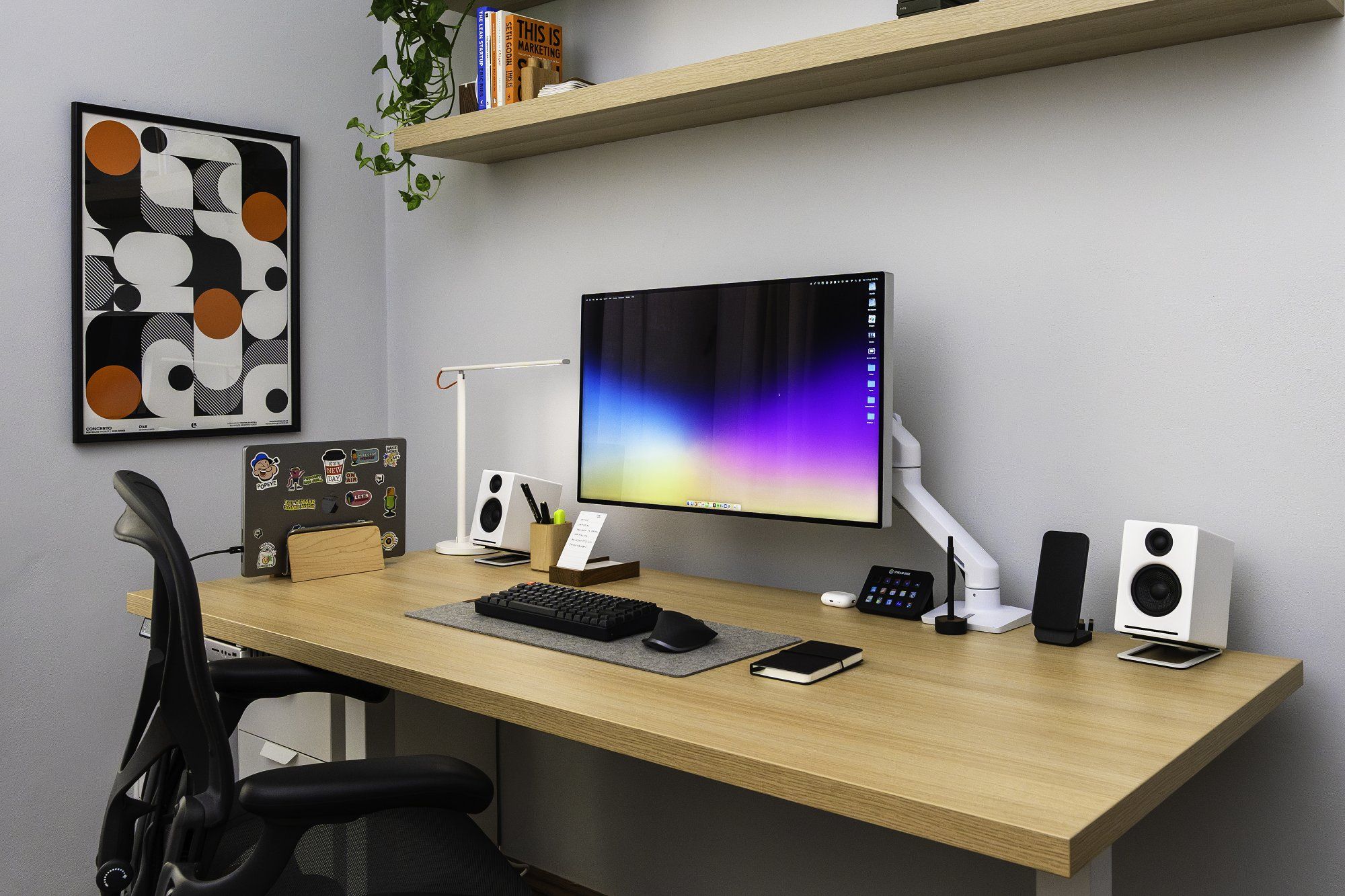 A minimal desk setup featuring a custom-made desktop mounted on Autonomous legs