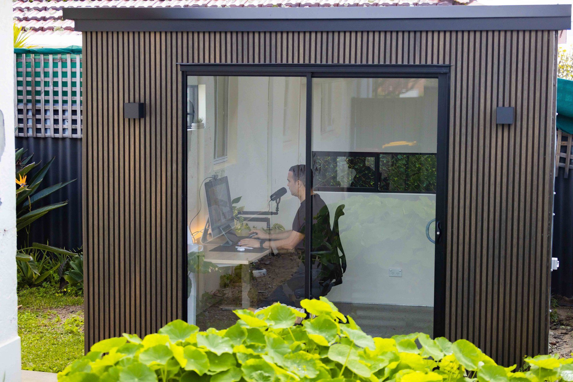 A designer working from his garden office pod