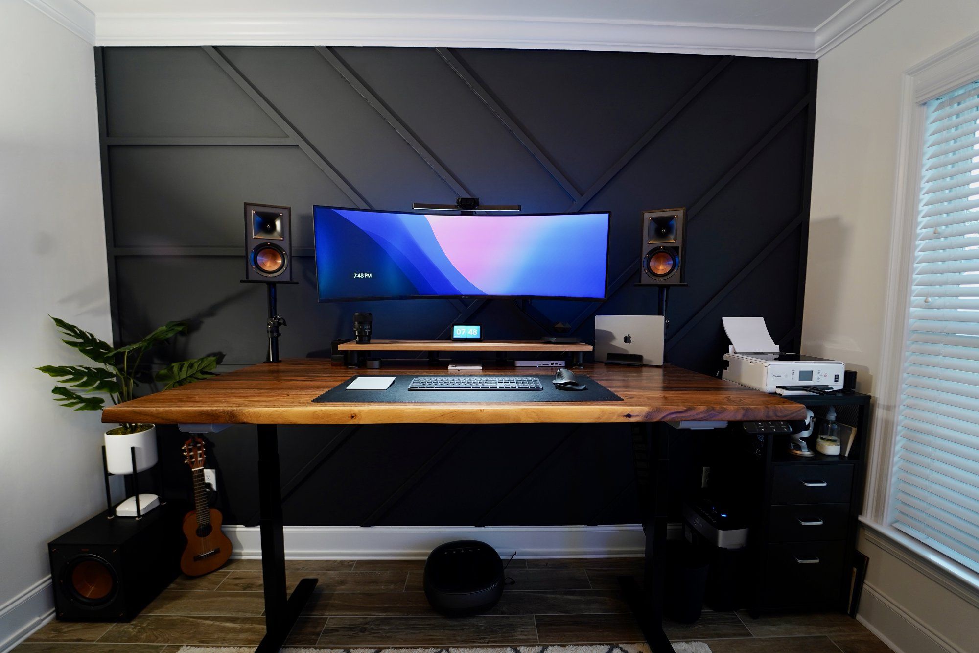 A standing desk home office setup