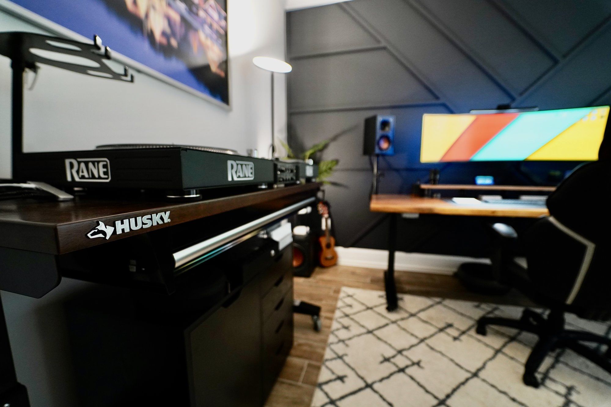 An angle view of a DJ setup in a home office space