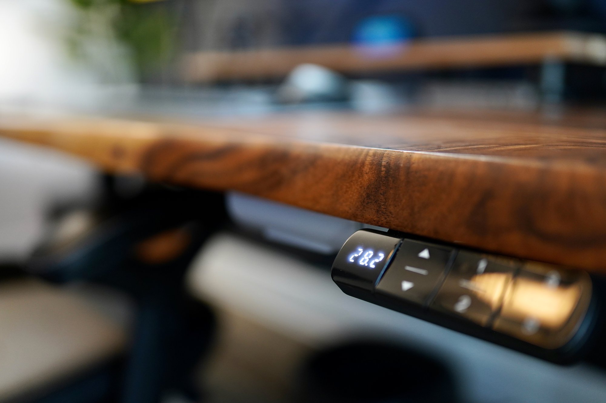 A close-up of the standing desk controller