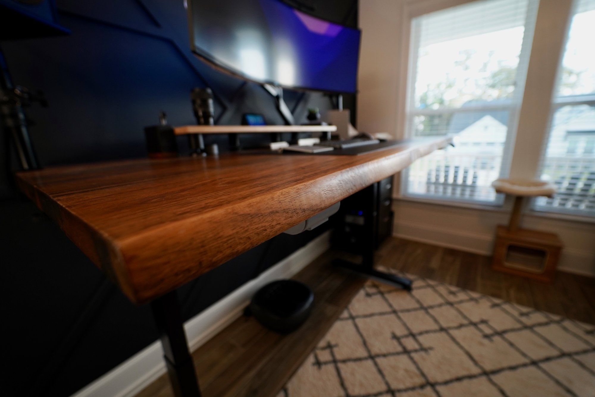 An angle view of a desk setup featuring an island countertop from Home Depot by the window