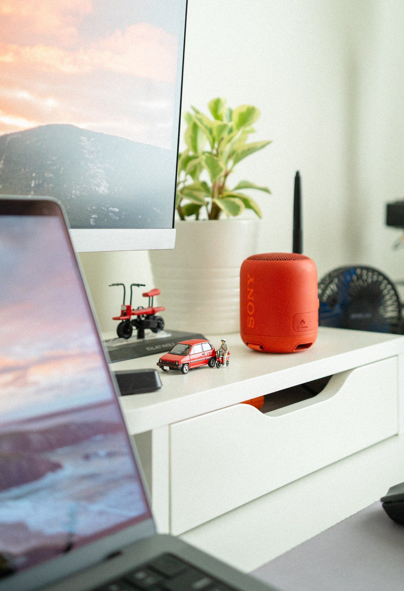 A compact and portable Sony wireless speaker in red