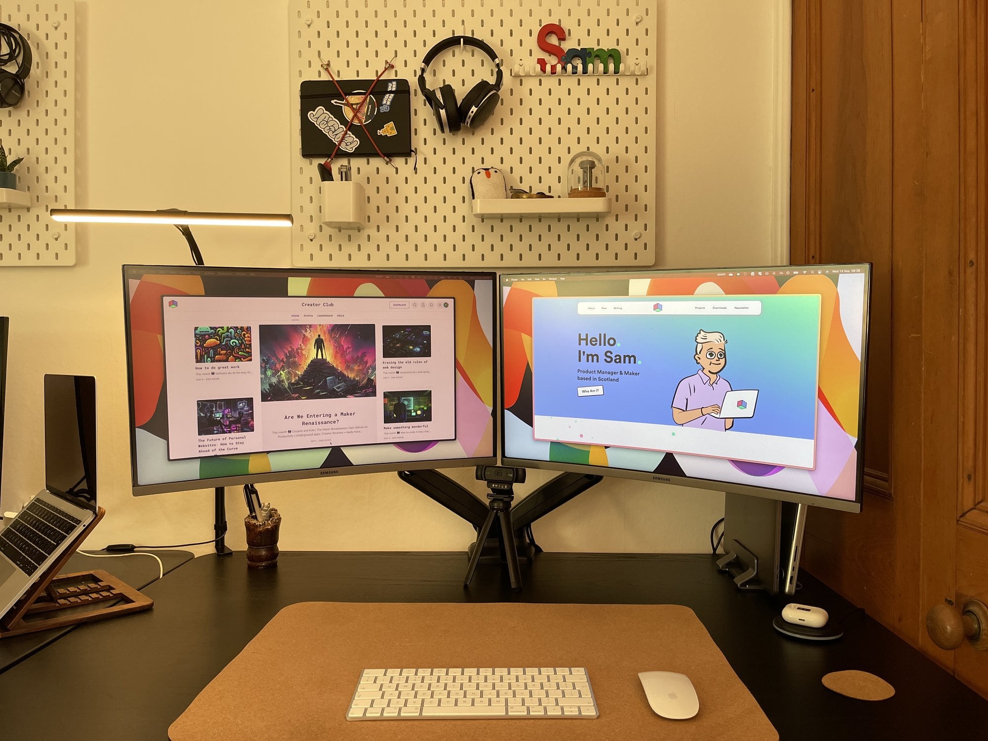 A dual-monitor desk setup with pegboards