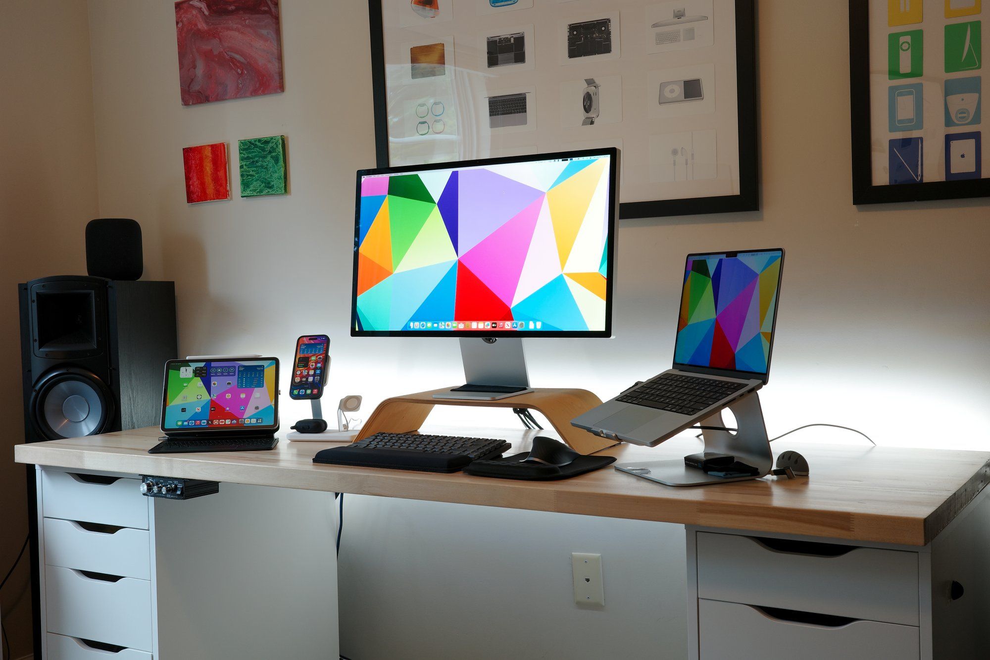 A bright, modern, and well-equipped personal home office with the Apple desk setup