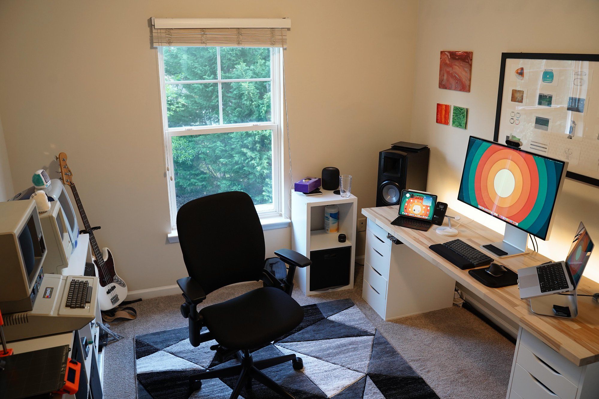 A modern home workspace featuring a high-backed, ergonomic office chair