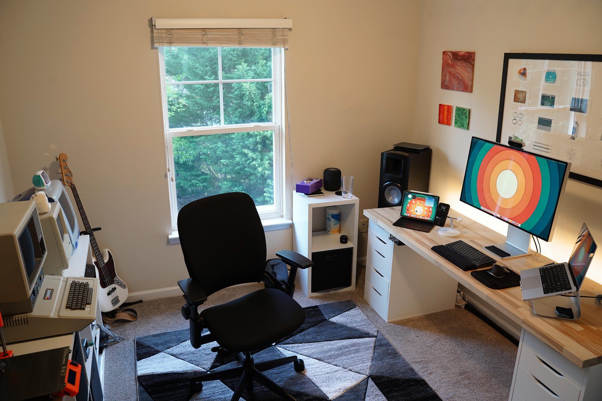 A modern home workspace featuring a high-backed, ergonomic office chair