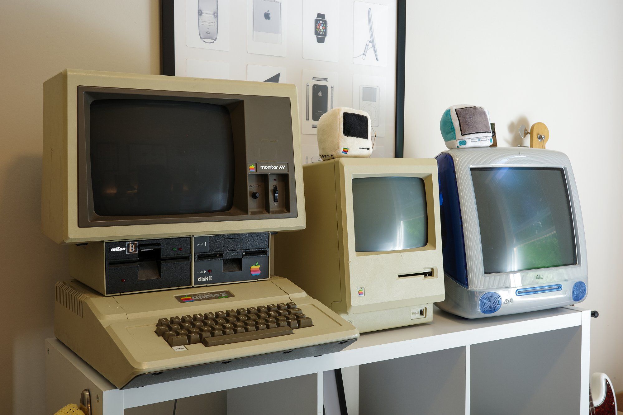 An Apple II Plus computer, a Macintosh 512K, and an iMac G3