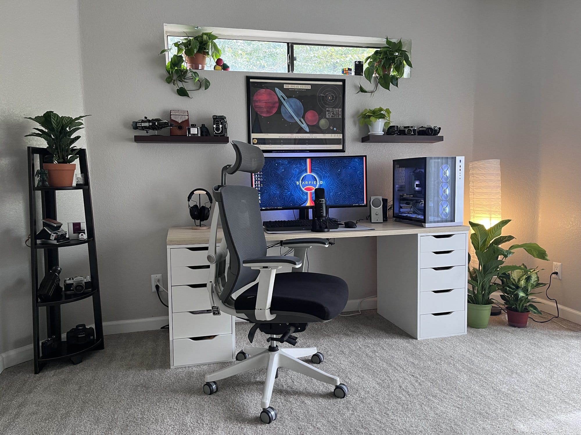 A clean and simple home office desk setup for a videographer