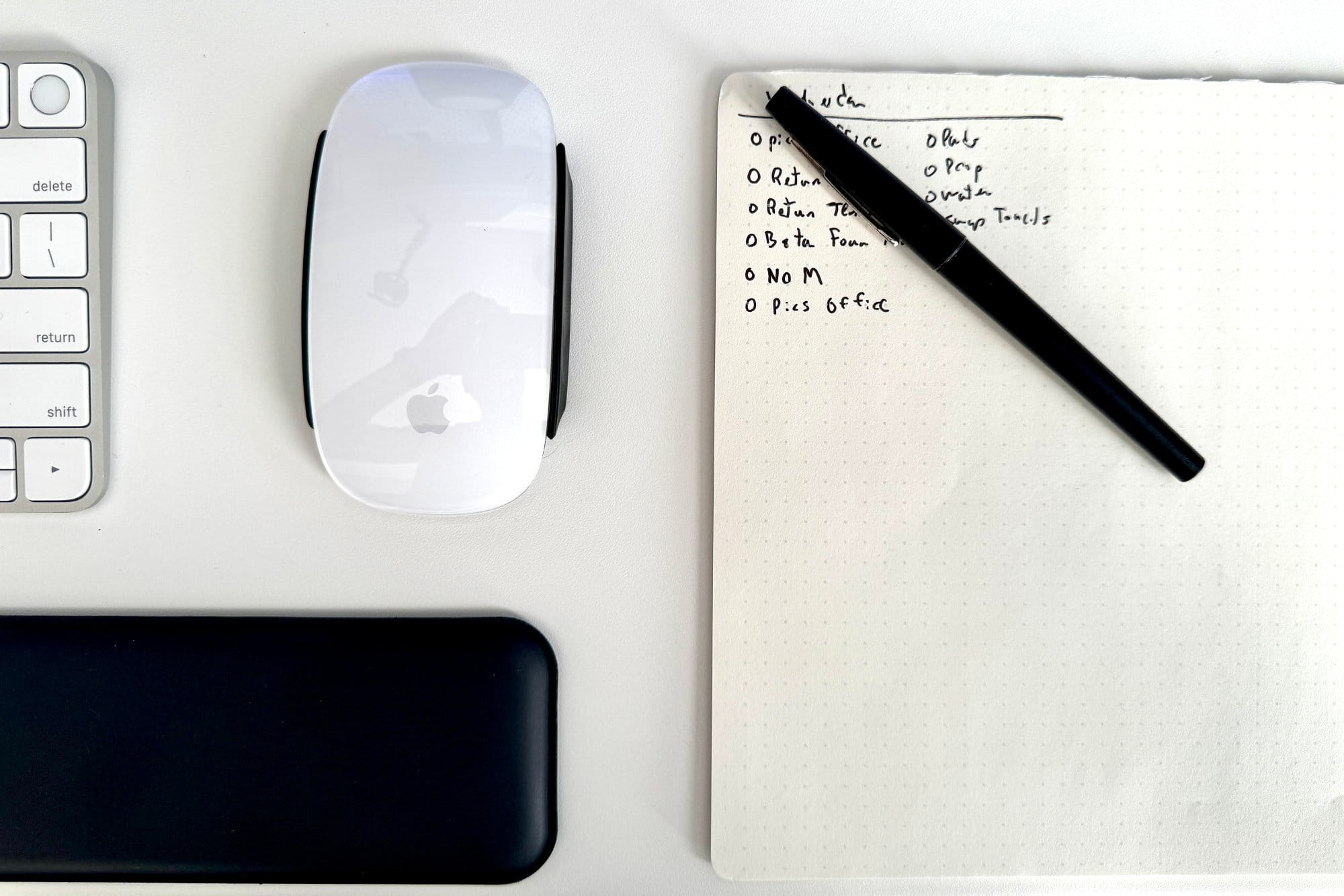 A close-up of desk setup peripherals and accessories