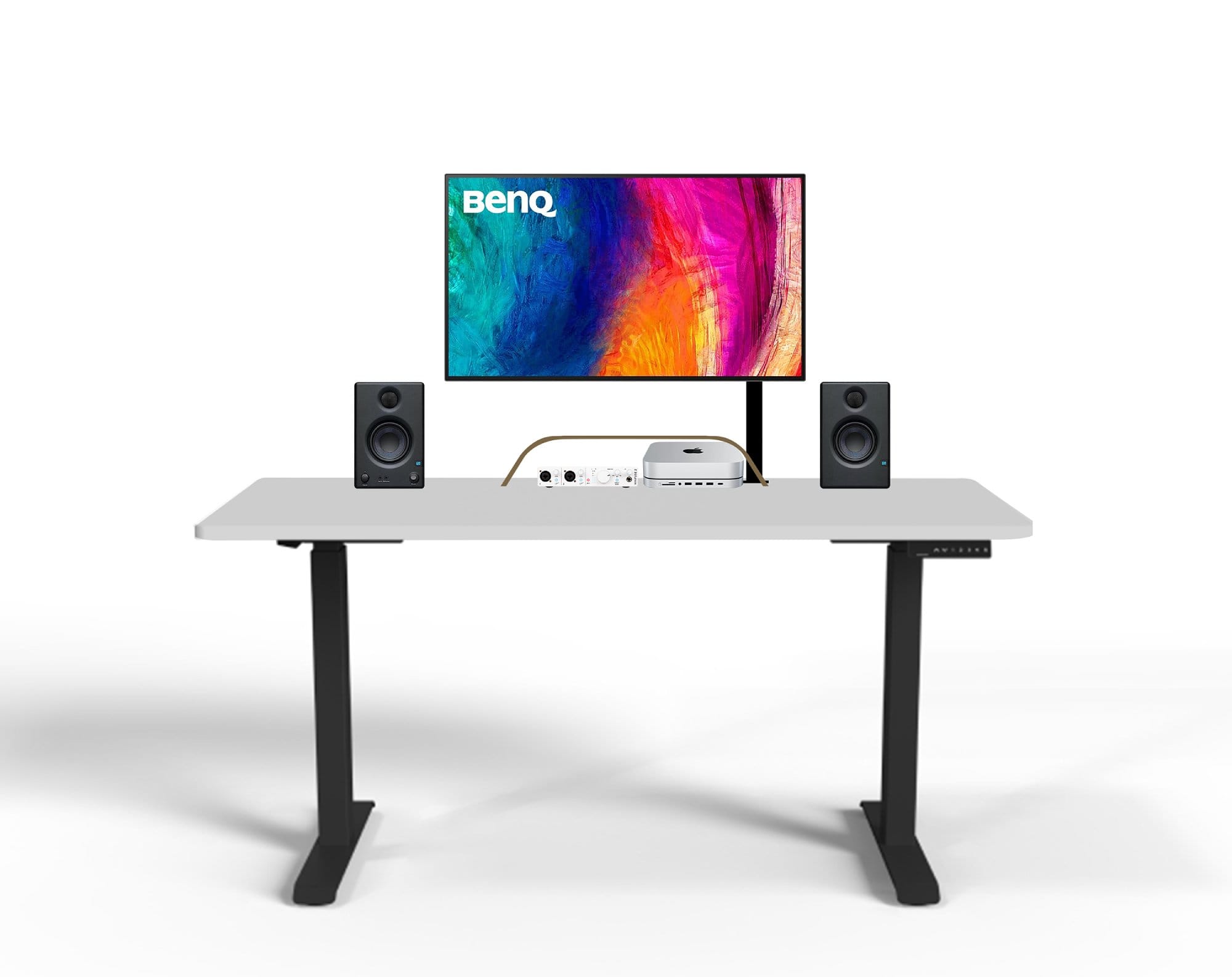 A mock-up of the minimalist desk setup with a BenQ monitor displaying a colourful abstract image, speakers on either side, and an audio interface, with a white tabletop and black legs on an isolated white background