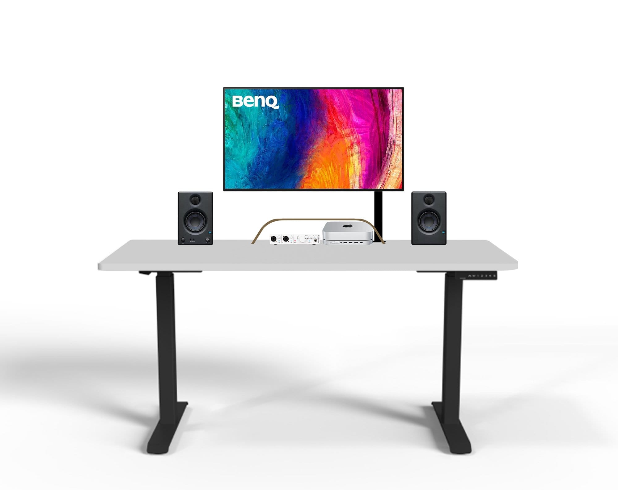 A mock-up of the minimalist desk setup with a BenQ monitor displaying a colourful abstract image, speakers on either side, and an audio interface, with a white tabletop and black legs on an isolated white background