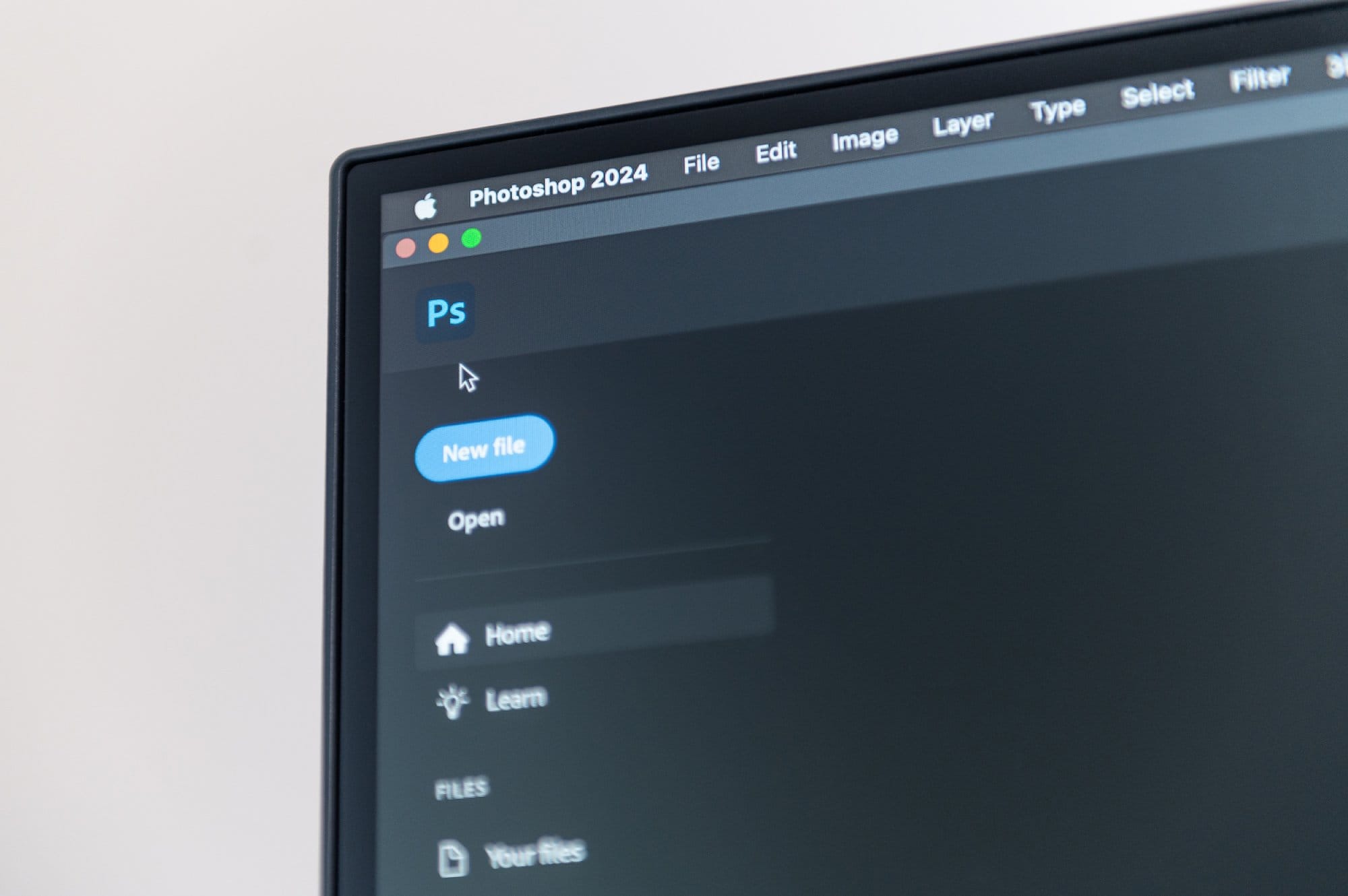 A close-up of a computer monitor displaying the Photoshop 2024 interface