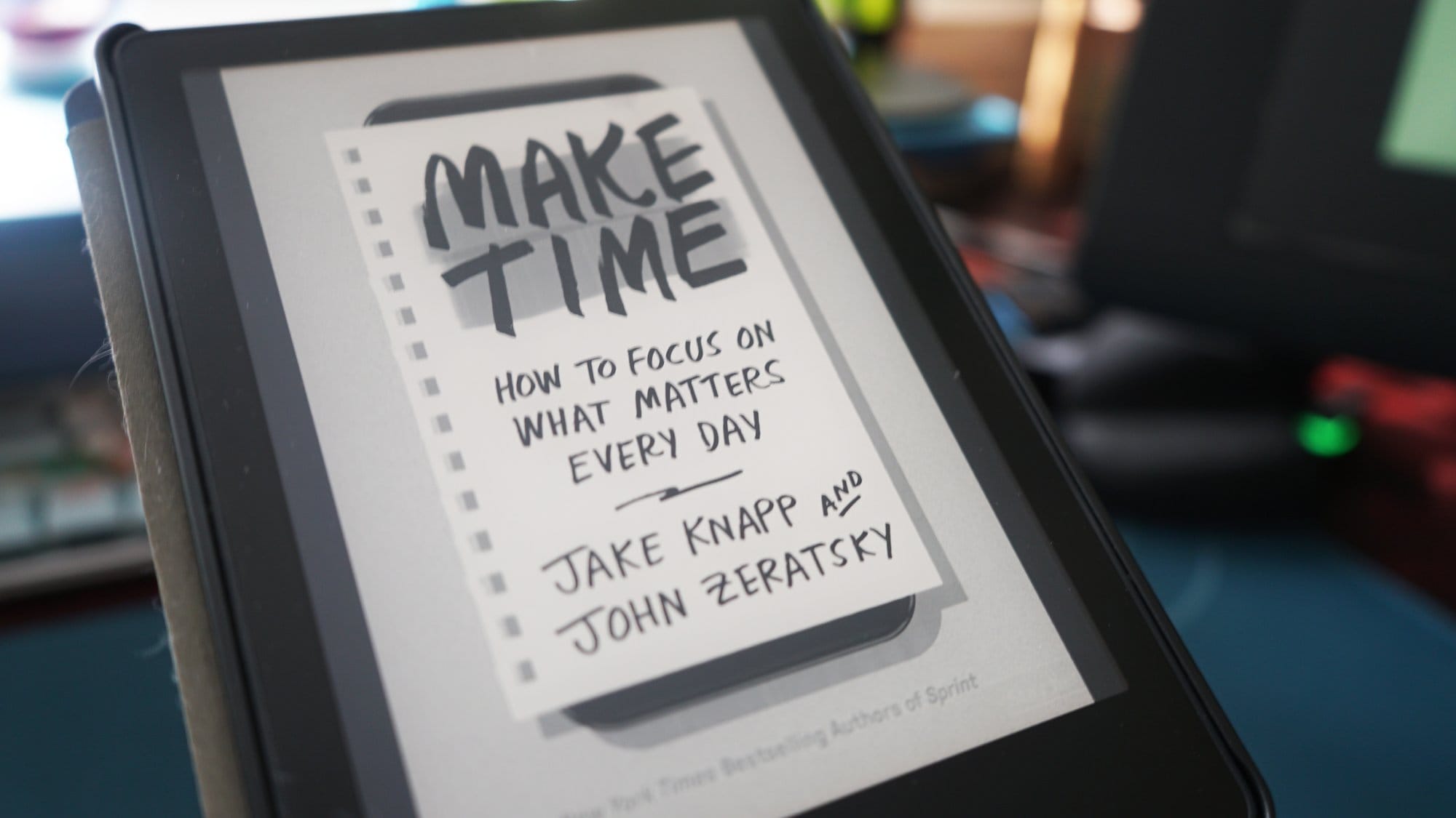 An e-reader screen displaying the cover of the book “Make Time: How to Focus on What Matters Every Day” by Jake Knapp and John Zeratsky