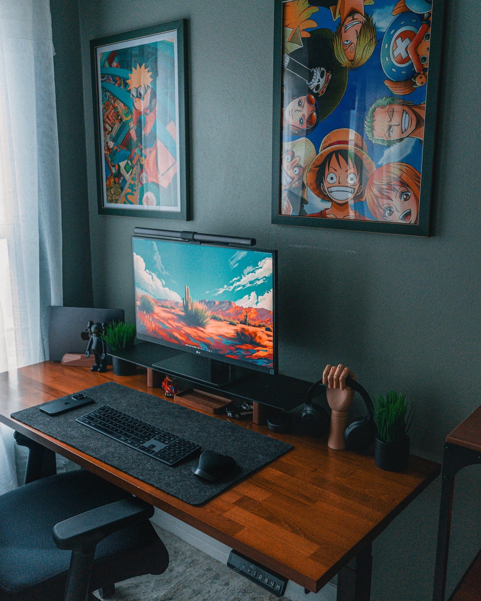 A modern desk setup featuring an LG 27″ 27BN88U-B Ergo monitor, BenQ Halo LightBar, 14″ M3 MacBook Pro, Edifier W820NB headphones, Edifier R1700BTS speakers, a Satechi Slim X3 keyboard, Logitech MX Master 2S mouse, and a Hexcal desk mat, complemented by anime posters of Naruto and One Piece on the wall
