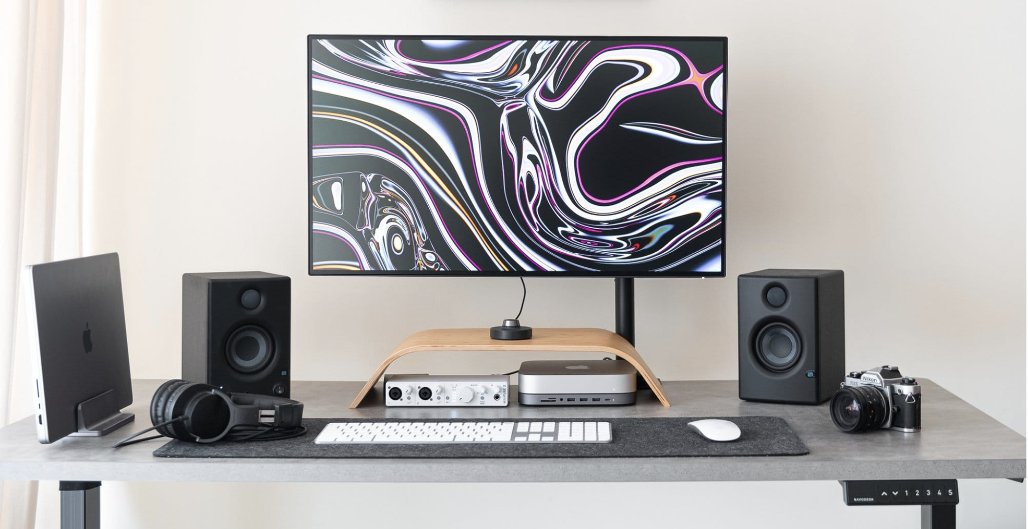 A clean and minimal desk setup with a Satechi USB C hub