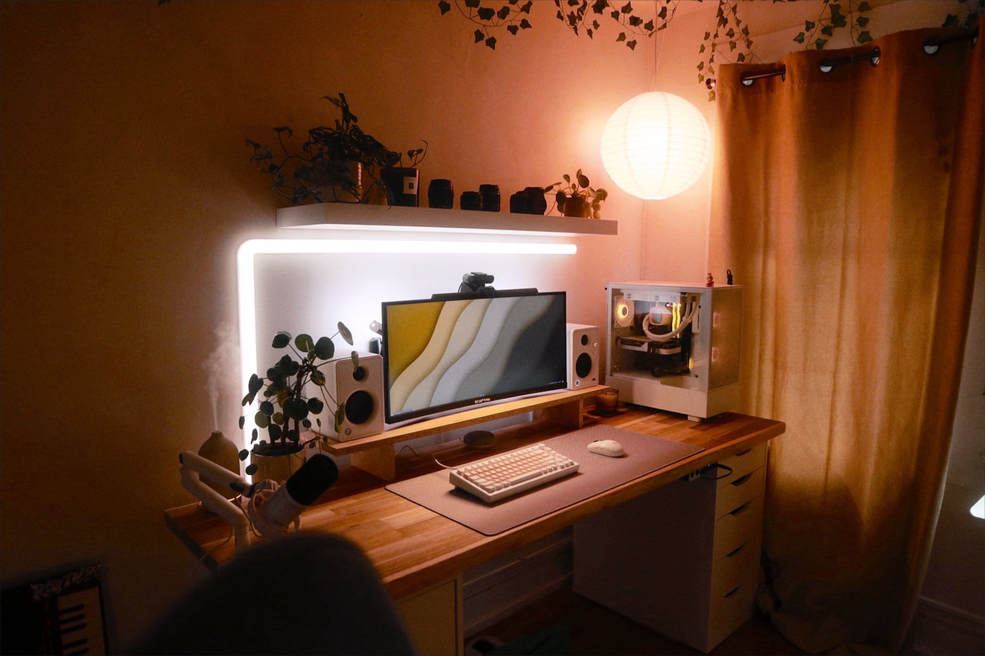 A soft, moody small home office with a floating desk
