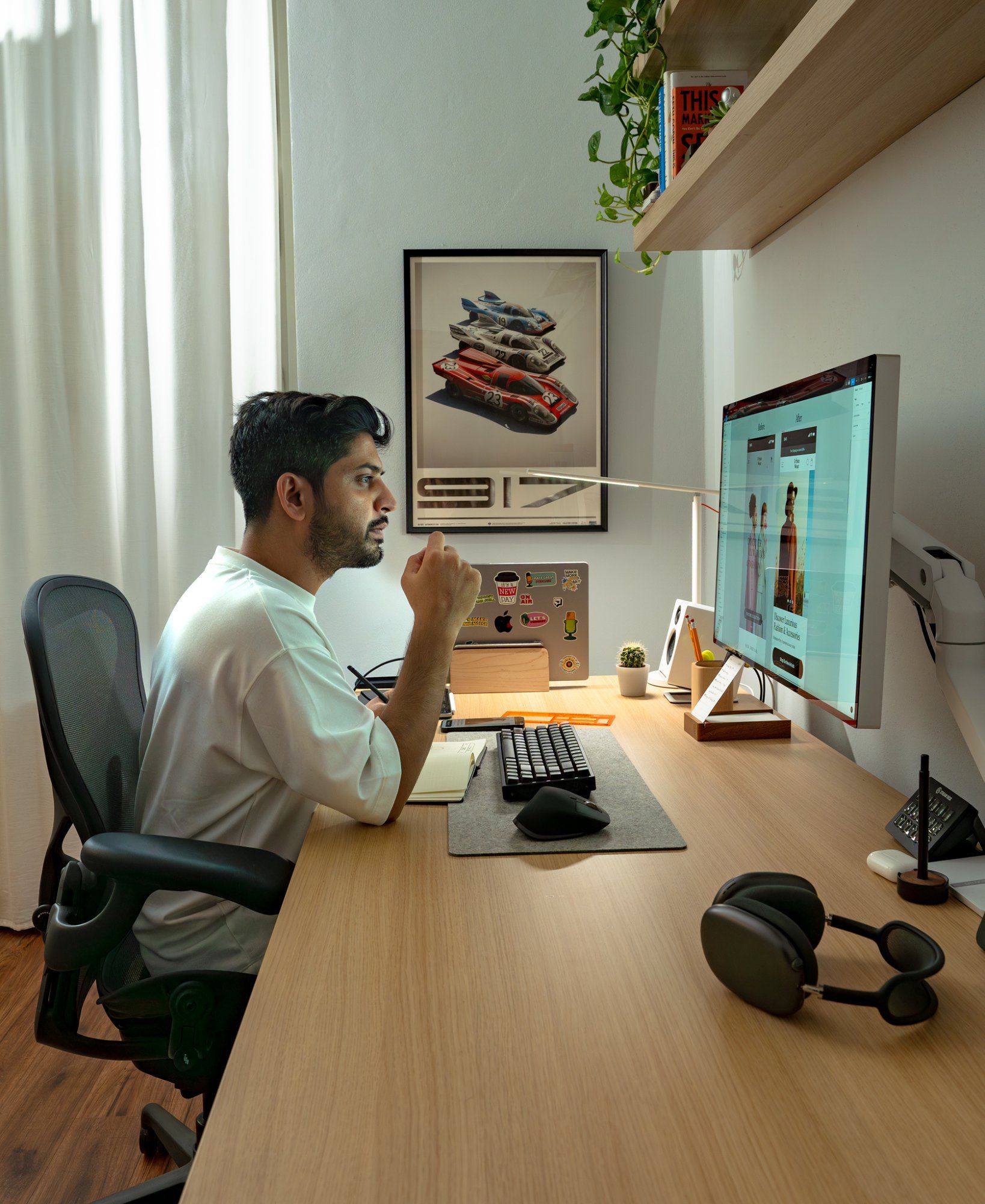 Faizur Rehman, an independent content creator, designer, and educator, at his desk