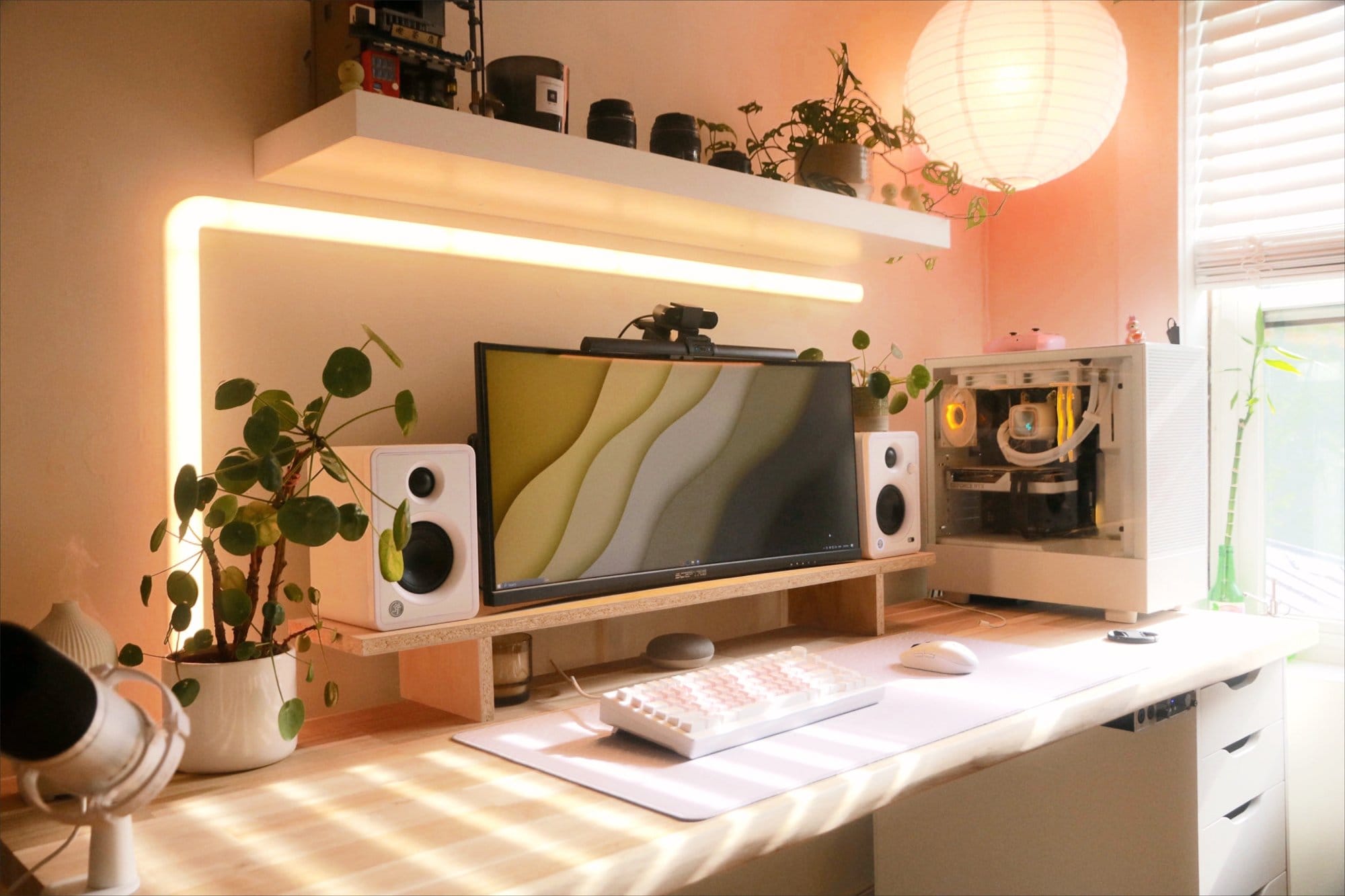 A well-lit workspace with a Sceptre 30″ Ultrawide monitor, Mackie CX3 speakers, an AKKO MOD 007 PC keyboard, and a Pilea houseplant
