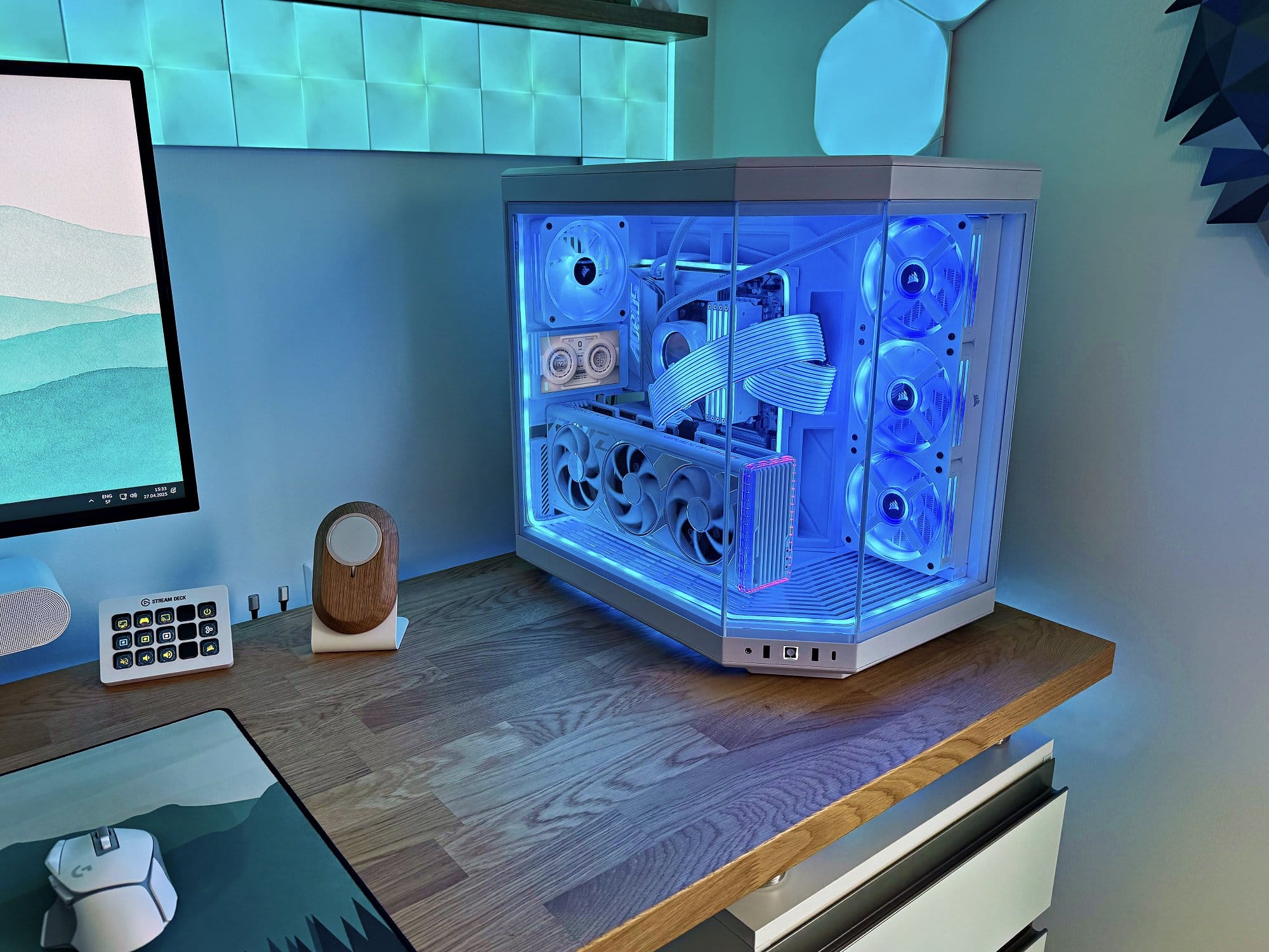 A custom-built PC with a Hyte Y70 case, Corsair QX120 fans, and white Lian Li Strimer Plus V2 RGB cables