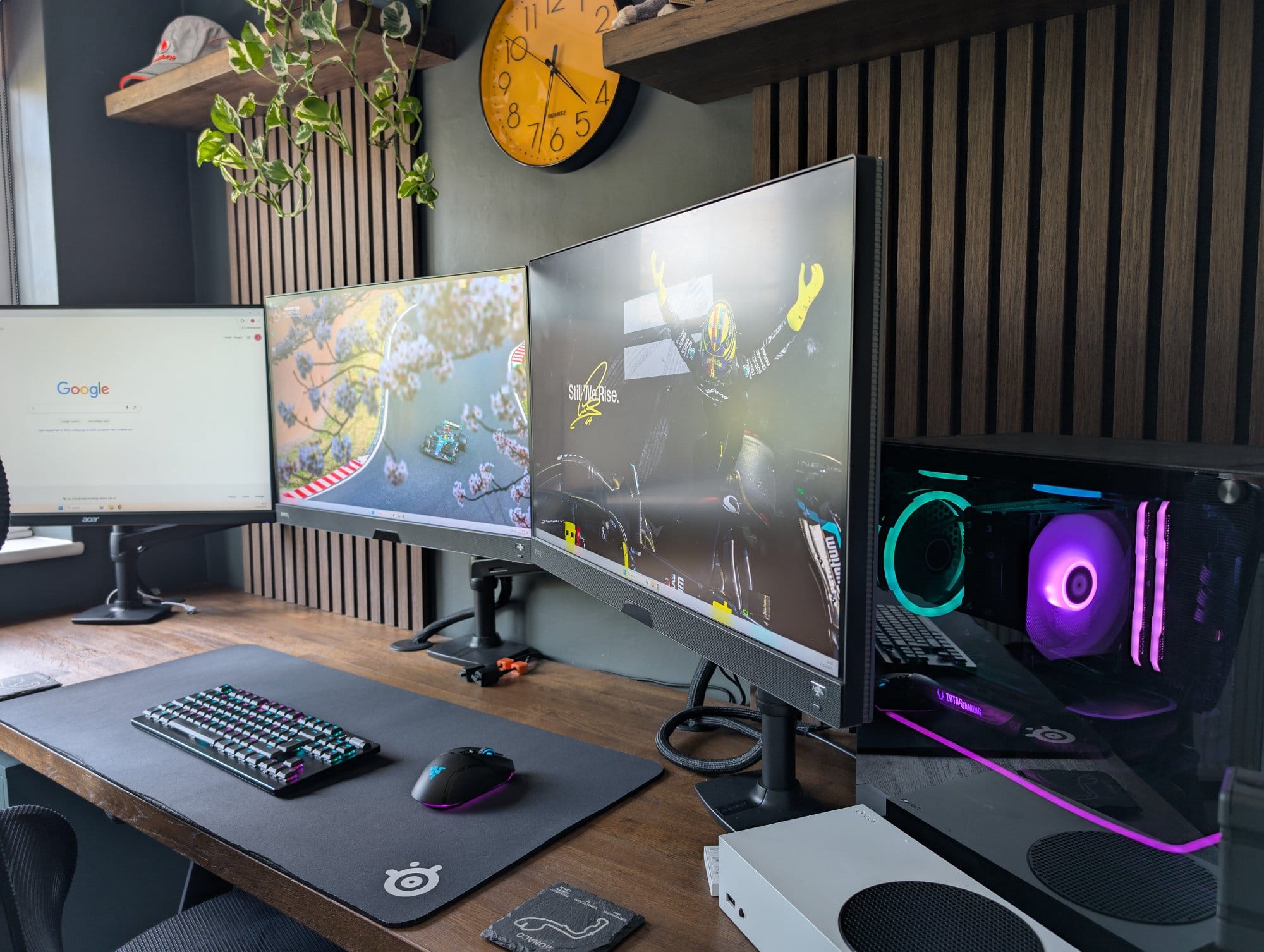 A desk setup with 3 monitors, Razer Basilisk V3 Pro mouse, custom PC build, and Xbox Series S