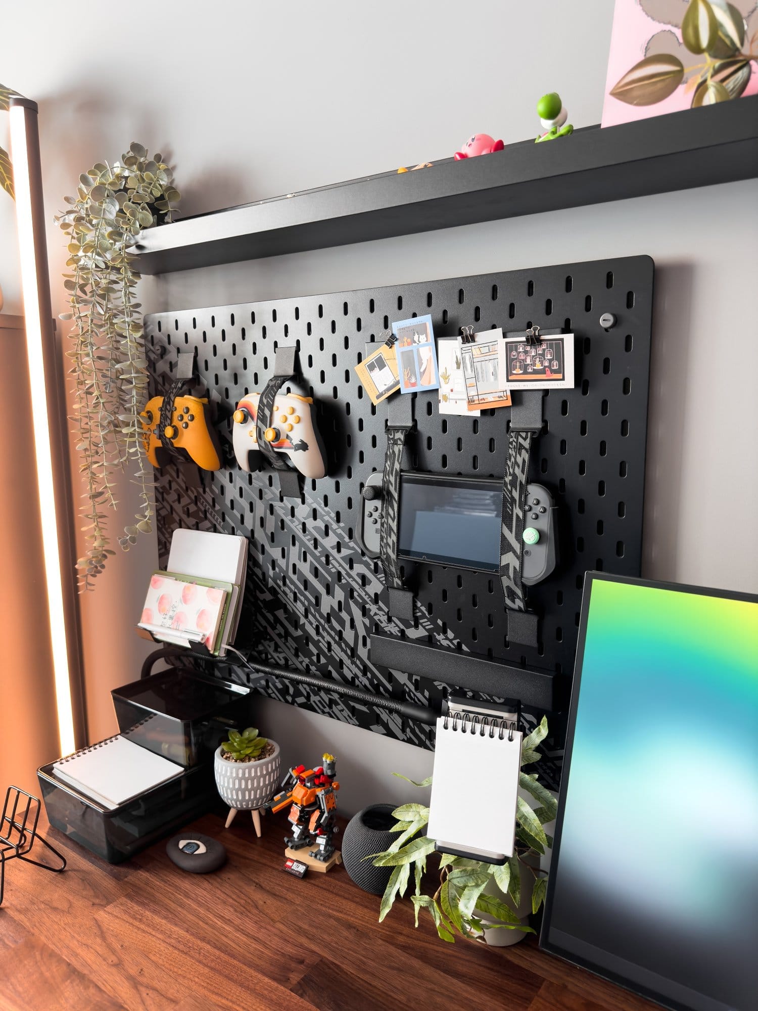 A designer desk setup with IKEA UPPSPEL pegboard