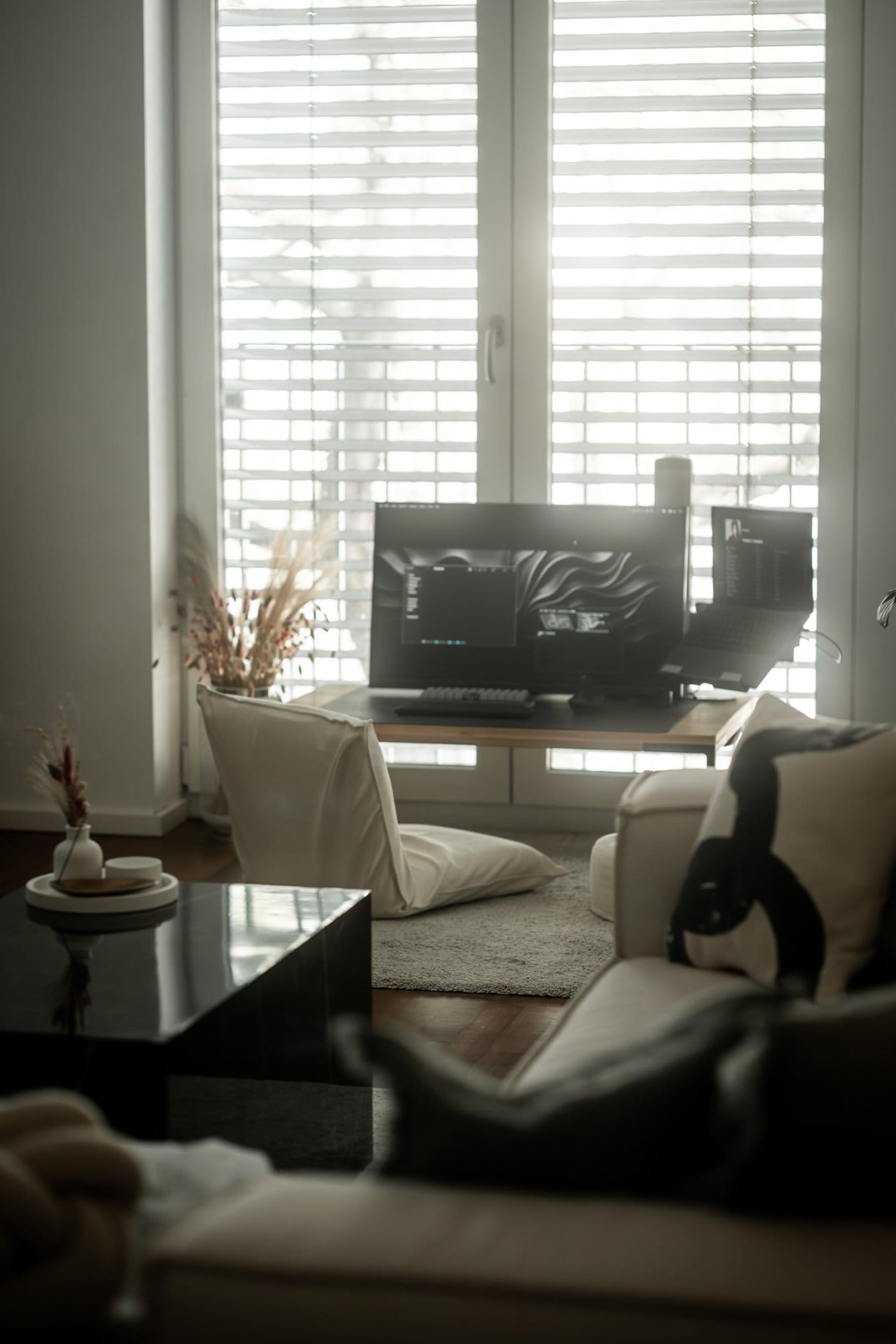 A Japandi-style living room with floor desk and Acer Nitro monitor