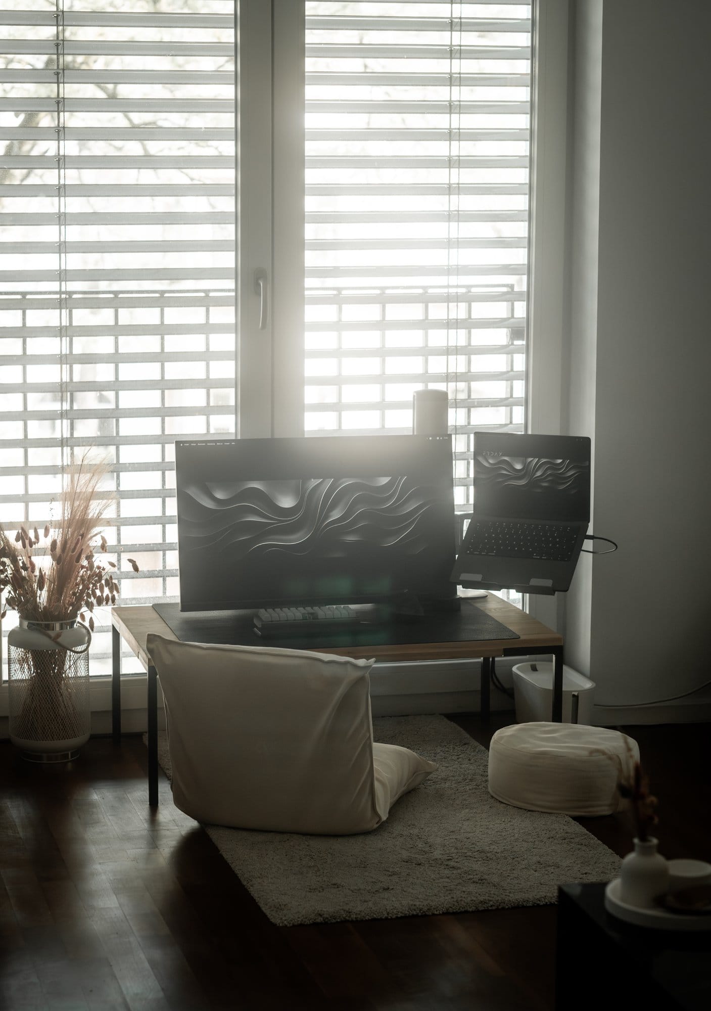 A Japandi home workspace with a MUJI floor chair and yoga cushion