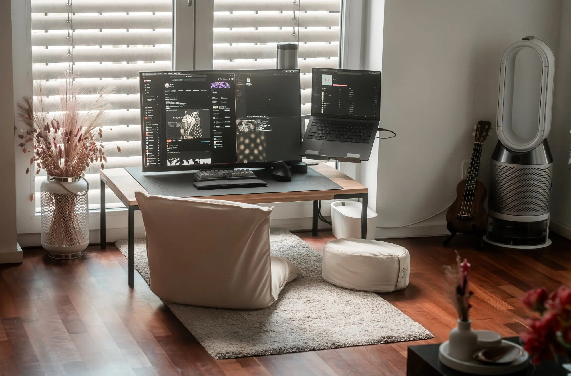 A home office with a MUJI floor chair and yoga pillow