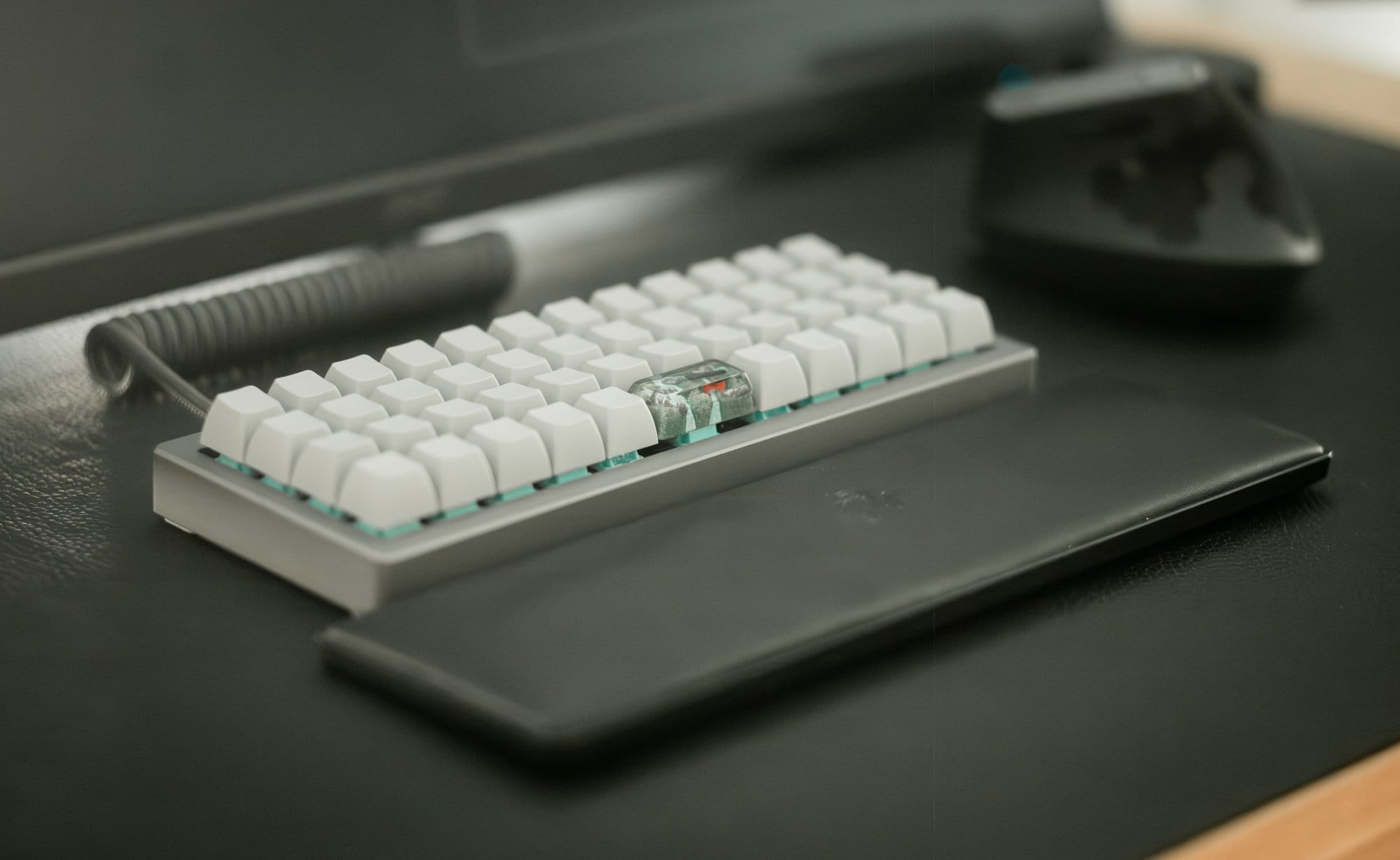 A close-up of OLKB Planck keyboard and Logitech MX Vertical mouse