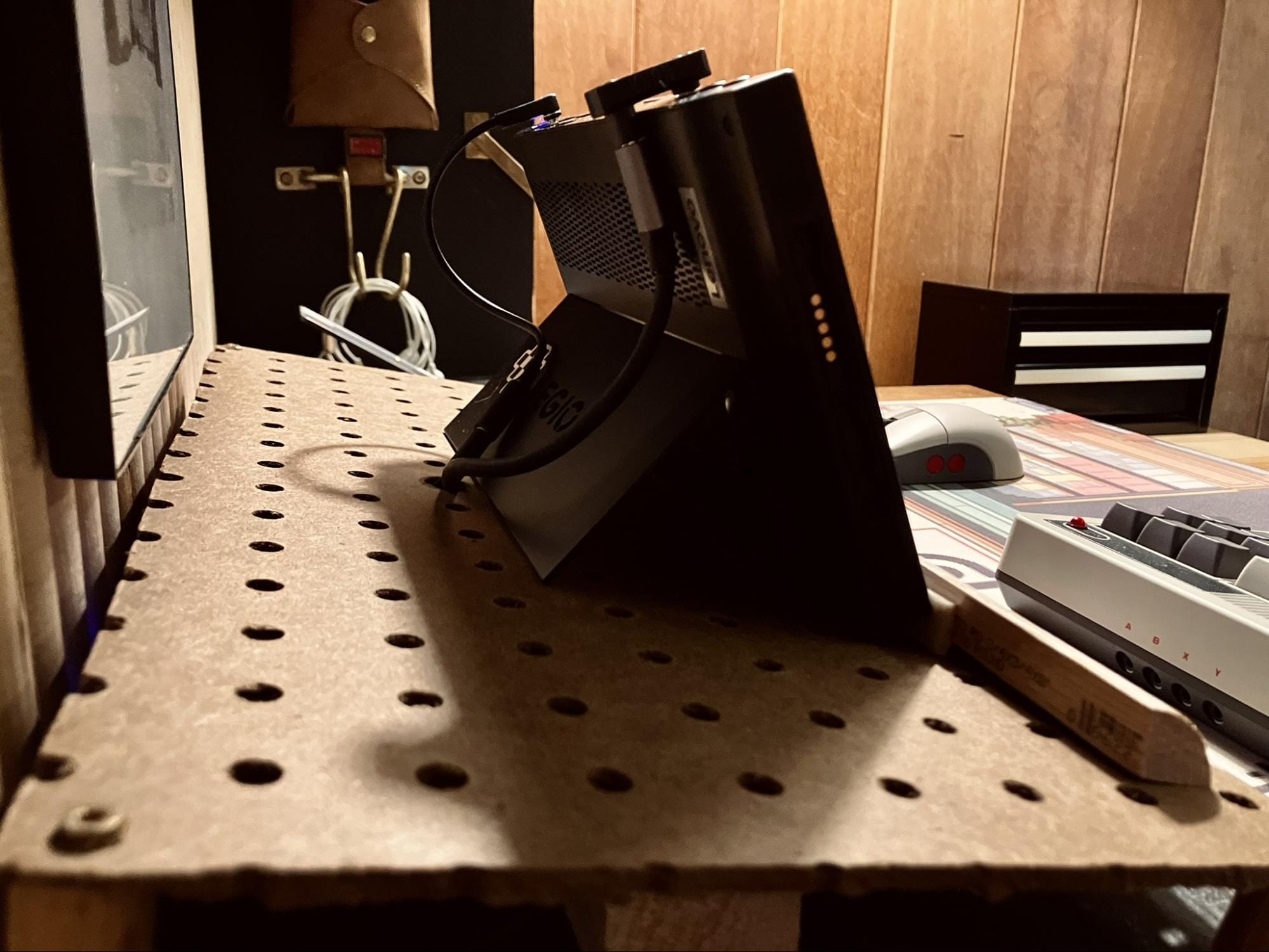 close-up of Lenovo Legion Go handheld gaming PC on a retro desk setup