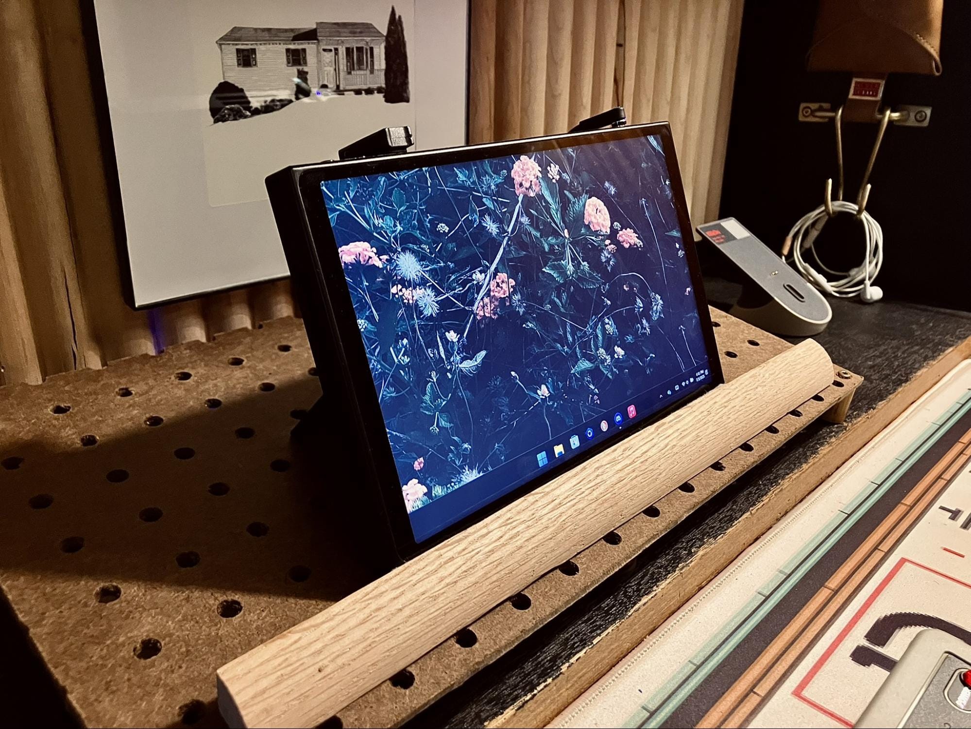 close-up of Lenovo Legion Go handheld gaming PC on a retro desk setup