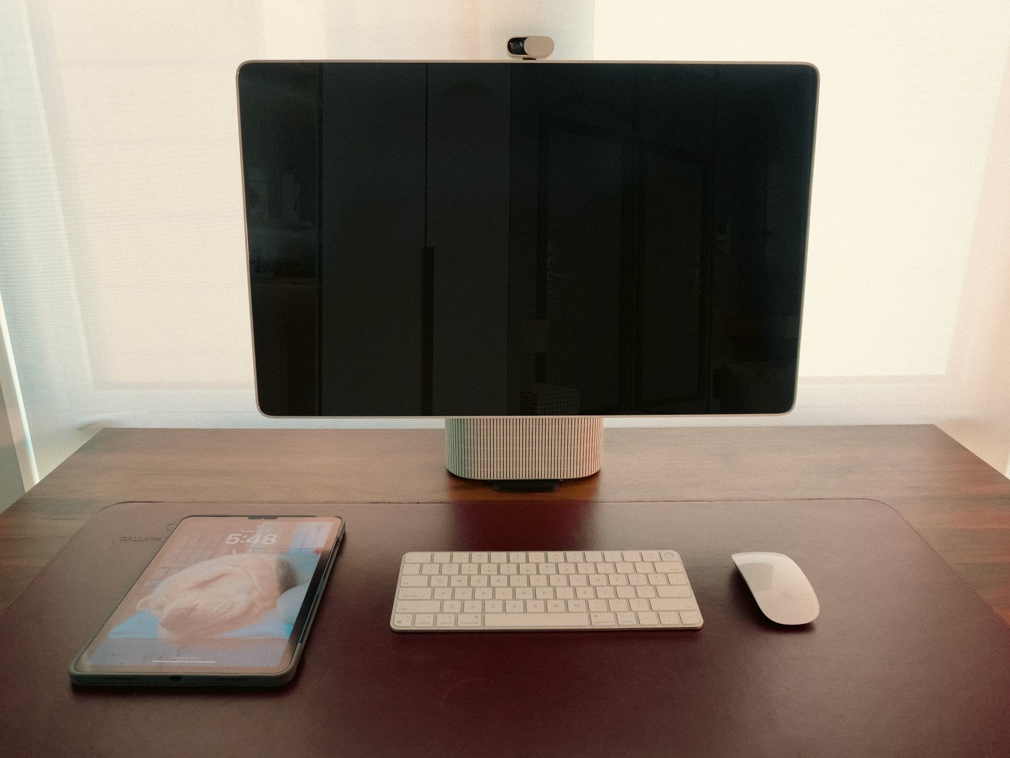 the HomeTechCo Home Display on a desk with a keyboard, mouse, and tablet
